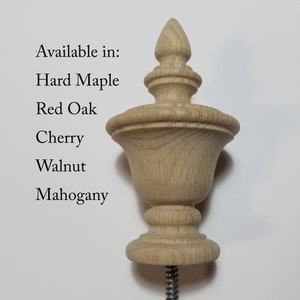 May include: A wooden finial with a bulbous top and a pointed finial. Available in Hard Maple, Red Oak, Cherry, Walnut, and Mahogany.