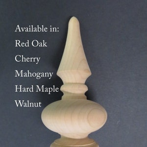 May include: A wooden finial with a pointed top and a rounded base. Available in Red Oak, Cherry, Mahogany, Hard Maple, and Walnut.