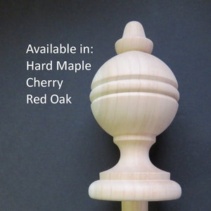 May include: A wooden finial with a round top and a base. Available in Hard Maple, Cherry, and Red Oak.