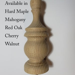 May include: A wooden finial with a bulbous top and a fluted base. Available in Hard Maple, Mahogany, Red Oak, Cherry, and Walnut.