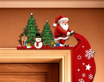 May include: A Christmas-themed door frame decoration featuring Santa Claus, a reindeer, a snowman, and two Christmas trees. Santa is holding a red sack with snowflakes and stars. The decoration is red, green, white, and brown.