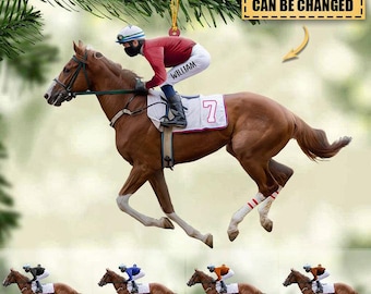 May include: A horse racing ornament featuring a jockey in red and white riding a brown horse. The jockey's pants are labeled "WILLIAM" and the horse's saddlecloth has the number "7". The text "NAME&NUMBER CAN BE CHANGED" is also visible.