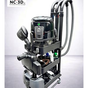 Könnte beinhalten: Ein schwarzes und graues Reinigungssystem mit Staubsauger und verschiedenen Aufsätzen. Das System befindet sich auf einem Rollwagen mit drei Ablagen. Der Text "NC-3D CleanStation" und "kompatibel mit Hyla EST" sind sichtbar.
