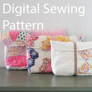 May include: Four quilted fabric bags in various colors and patterns, including pink, white, and floral designs. The bags are displayed on a gray surface with the text "Digital Sewing Pattern" above them.