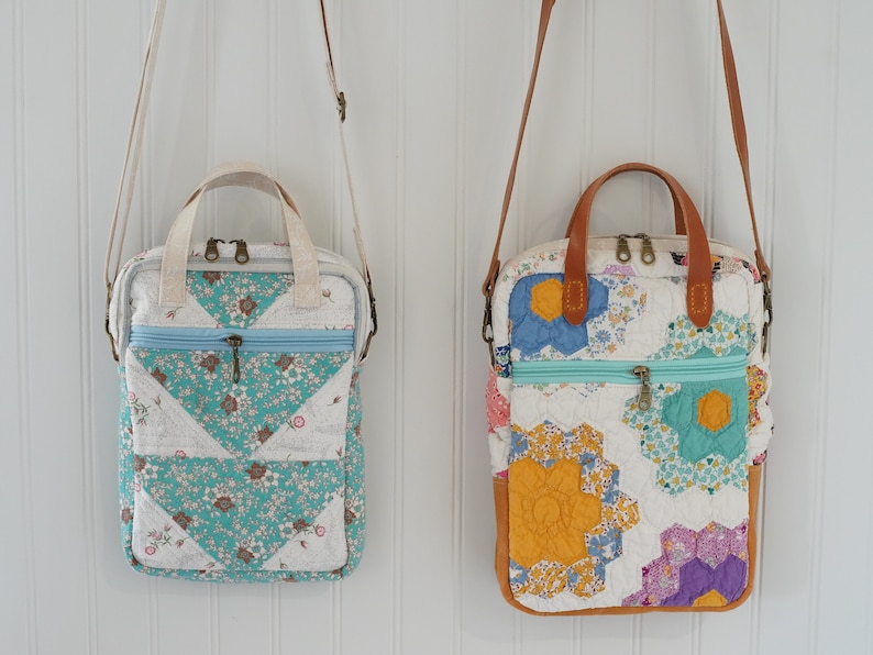 May include: Two quilted crossbody bags with floral patterns and zip closures. One bag features a teal and white floral design, while the other showcases a patchwork of colorful floral fabrics. Both have top handles and adjustable straps.