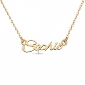 May include: A gold-toned necklace featuring a nameplate pendant with the name Sophie written in a cursive script font. The pendant is attached to a delicate cable chain that connects to both sides of the nameplate with small circular jump rings.