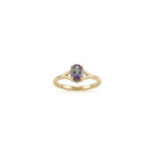 May include: A gold ring featuring an oval-cut iridescent gemstone with purple, green, and blue hues. The band has a split-shank design that meets at the four-prong setting holding the central stone, creating a polished and reflective appearance.