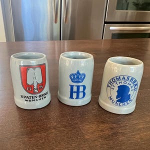 Miniature German Beer Steins - Set of 3 - Shot Glass Sized- Collectible Souvenirs featuring Munich-based Breweries