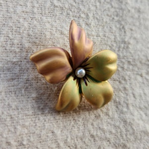 Joan rivers flower brooch