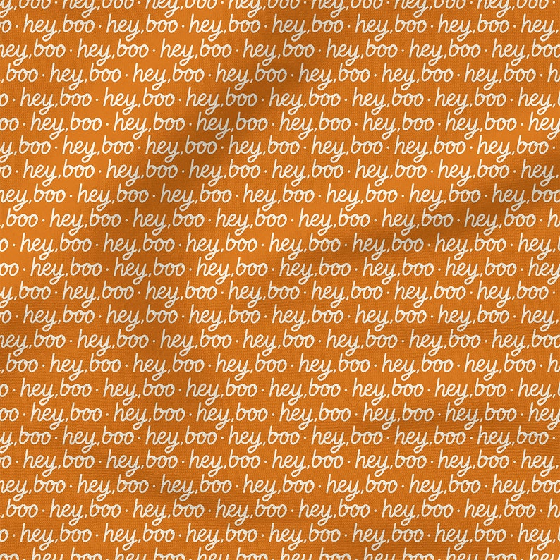 May include: A vibrant orange fabric featuring a repeating pattern of the text "hey boo" written in a white, cursive, handwritten-style font. The text is arranged in horizontal rows across the entire surface of the textile material.