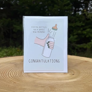 Faire éclater les bouteilles a une toute nouvelle signification | Carte de fête de naissance | carte de voeux de bébé | Nouveau bébé | Cartes de voeux amusantes