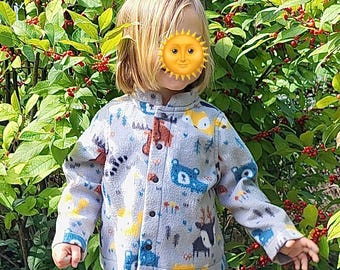 May include: A child wearing a gray fleece jacket with a colorful animal print. The jacket has a button closure and a stand-up collar.