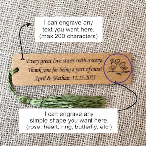 May include: Wooden bookmark with a green tassel. The bookmark is engraved with the text "Every great love starts with a story. Thank you for being a part of ours! April & Nathan 11.15.2025". The bookmark also features a small engraved image of two birds on a branch.