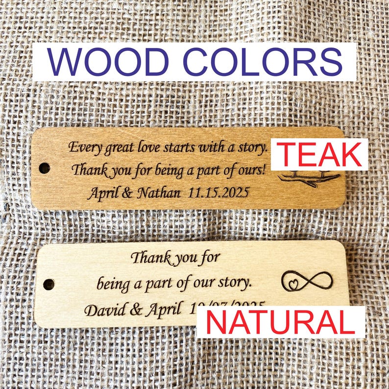 May include: Two wooden signs with engraved text. The top sign is teak wood and says "Every great love starts with a story. Thank you for being a part of ours! April & Nathan 11.15.2025". The bottom sign is natural wood and says "Thank you for being a part of our story. David & April 1 10/07/2025".