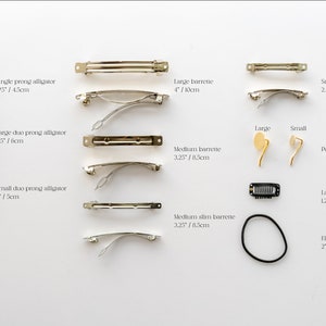 May include: Assortment of hair clips and accessories in gold and black.  Includes single prong alligator clips, large duo prong alligator clips, small duo prong alligator clips, large barrettes, medium barrettes, medium slim barrettes, small barrettes, pony hooks, latch wisp clips, and elastic bands.  Measurements are included in inches and centimeters.