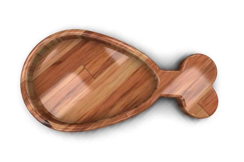K&ouml;nnte beinhalten: Eine Servierplatte aus Holz in Form eines H&auml;hnchenschenkels. Die Platte ist aus hellbraunem Holz mit einer glatten Oberfl&auml;che.
