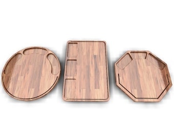 May include: Three wooden serving trays with different shapes and sizes. The trays have a natural wood finish and feature carved grooves for serving various foods.