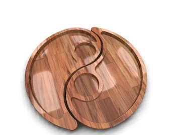 May include: A wooden serving tray shaped like a yin yang symbol. The tray has two separate compartments, each with a smooth, polished surface.