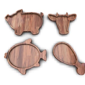 K&ouml;nnte beinhalten: Satz von vier Holz-Serviertabletts in Form eines Schweins, einer Kuh, eines Fisches und eines H&auml;hnchenschenkels. Die Tabletts sind aus Naturholz in hellbrauner Farbe.