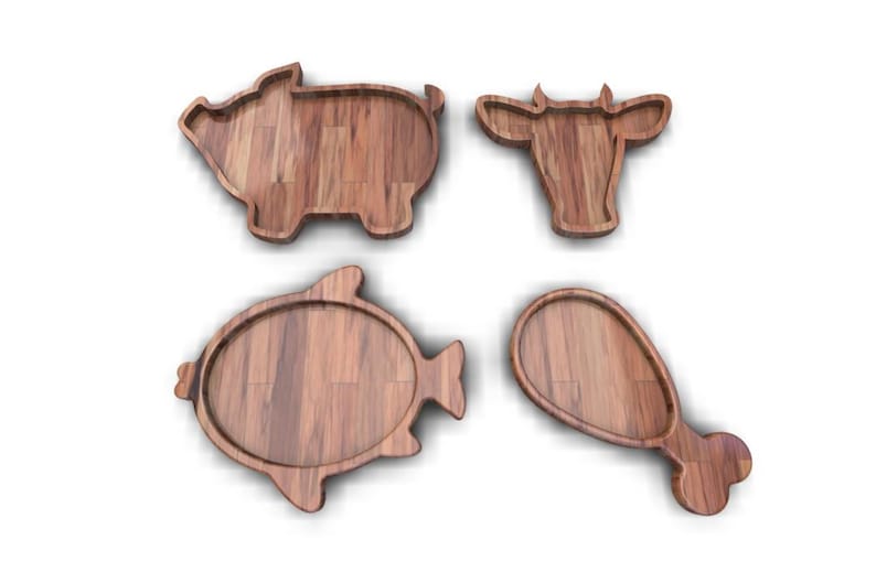 K&ouml;nnte beinhalten: Satz von vier Holz-Serviertabletts in Form eines Schweins, einer Kuh, eines Fisches und eines H&auml;hnchenschenkels. Die Tabletts sind aus Naturholz in hellbrauner Farbe.