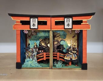May include: A miniature diorama depicting a Japanese scene with two figures, one in traditional samurai armour and the other in a colourful kimono. The diorama is framed by a red and gold torii gate with the word "日本" (Japan) written on it. The scene is set in a forest with a bridge and cherry blossoms.