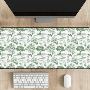 May include: A green and white patterned desk mat with a repeating design of dogs, trees, and houses. The mat is made of a durable material and is perfect for protecting your desk from scratches and spills.