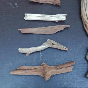 May include: A rustic wooden sign with the text "Welcome to our porch" in white lettering. The sign features a distressed finish and a simple, inviting design, perfect for outdoor decor.