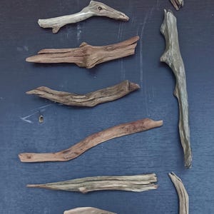 May include: A rustic wooden sign with the text "Welcome to our home" in a handwritten style. The sign features a distressed finish and a simple, inviting design, perfect for a front porch or entryway.