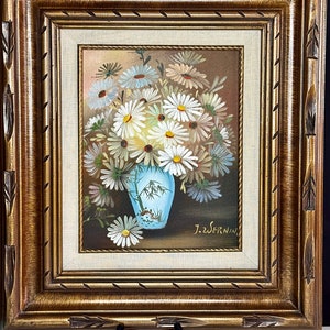May include: A framed painting of a bouquet of white daisies in a blue and white vase with a bamboo design. The painting is signed "J.Z.Wernin".