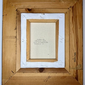 May include: A wooden frame with a white canvas inside. The canvas has the text "Classic Art - Woodmar Mall 6626 Indianapolis Blvd Hammond, In" printed on it.