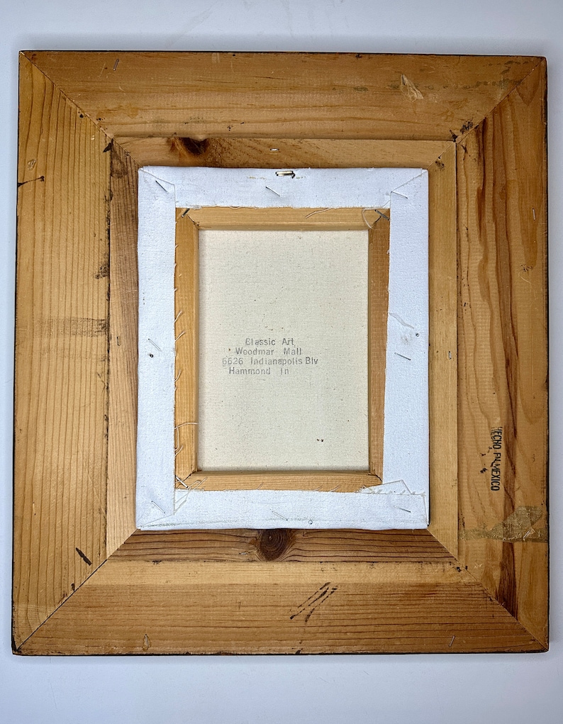 May include: A wooden frame with a white canvas inside. The canvas has the text "Classic Art - Woodmar Mall 6626 Indianapolis Blvd Hammond, In" printed on it.