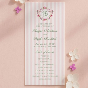 May include: A wedding program with a pink and white striped design. The program lists the names Reagan Anderson and Baylor Lombardo, the date August 16, 2028, and the order of events. Floral decorations are placed around the program.