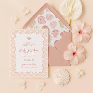 May include: A wedding invitation suite featuring a Save the Date card and envelope with a seashell pattern. The card is peach with a scalloped border and text that reads "Hailey & Adam are getting married 08.12.28". Decorative flowers and a seashell accent the design.