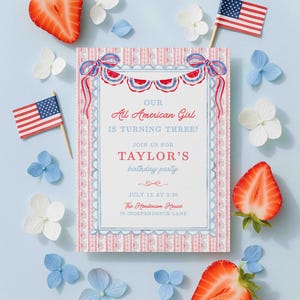 May include: A patriotic birthday party invitation with the text "Our All American Girl is Turning Three!" surrounded by red, white, and blue decorations, strawberries, and miniature American flags. The invitation includes the party details.