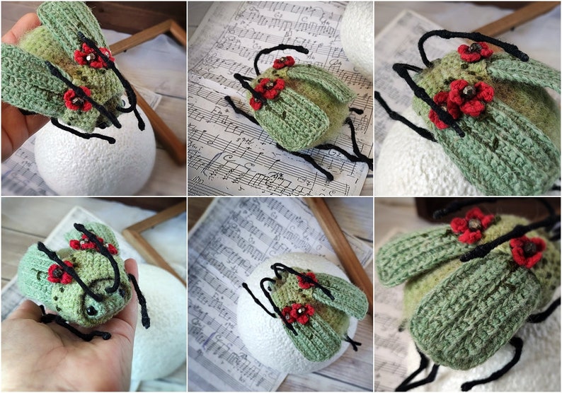 May include: A crocheted green beetle with red flower accents and black legs. The beetle is sitting on a white surface.