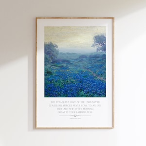 May include: A framed print with a watercolor painting of a field of blue flowers. The text "The steadfast love of the Lord never ceases: His mercies never come to an end: They are new every morning. Great is your faithfulness." is printed below the image.