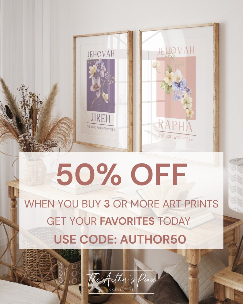 May include: Two framed art prints with floral designs. One print features a purple background with the text "JEHOVAH JIREH THE GOD WHO PROVIDES." The other print has a pink background with the text "JEHOVAH RAPHA THE GOD WHO HEALS." The prints are displayed on a wooden table.