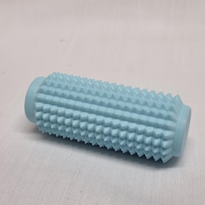 May include: A light blue foam roller with a textured surface covered in small spikes.
