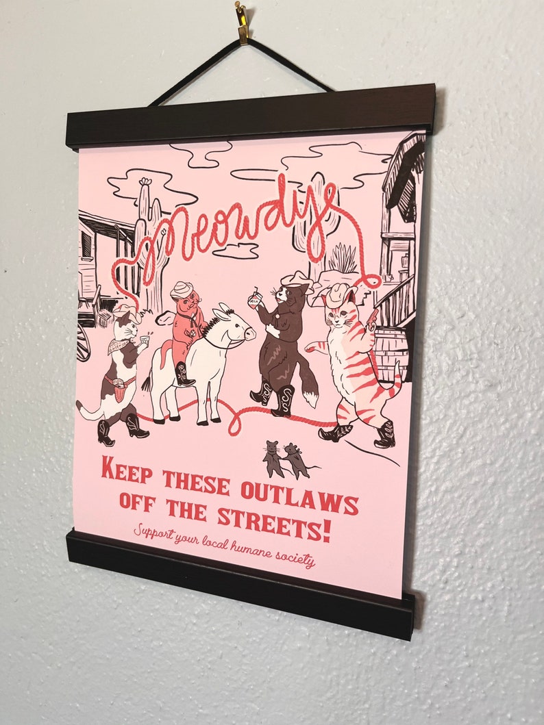 Original Meowdy Print pictured with poster rails