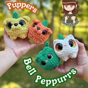 May include: Three small, plush, crocheted animal figures shaped like bell peppers in yellow, orange, and white, each with large, dark, glittery eyes, a small green stem on top, and a soft, textured yarn finish. Text reads Bell Puppers, Bell Peppurrs, and Yarnaholicsewciopath.