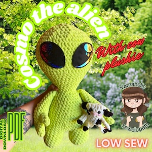 May include: A crochet pattern for a green alien plush toy holding a small cow plush toy. The pattern is called "Cosmo the Alien with cow plushie" and is a low sew pattern. The pattern is available as a digital PDF download.