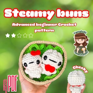 May include: A crochet pattern for making steamed buns. The pattern is called "Steamy Buns" and is described as an "Advanced Beginner Crochet Pattern". The image shows two crocheted steamed buns in a basket with green lettuce, and a single crocheted steamed bun.