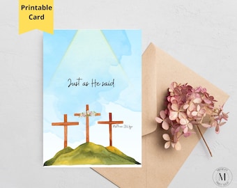 May include: A rectangular greeting card featuring a watercolor illustration of three wooden crosses on a green hill against a light blue sky. The text "Just as He said" is centered above the crosses, with "Matthew 28:6 KJV" written to the right.