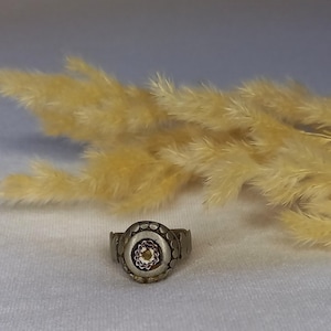 An ancient ring, made of silver, an old ring, a handmade ring, with beautiful glass on it.