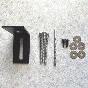 May include: A black metal bracket with a slot for a screw, five silver screws, a silver drill bit, and four silver washers.
