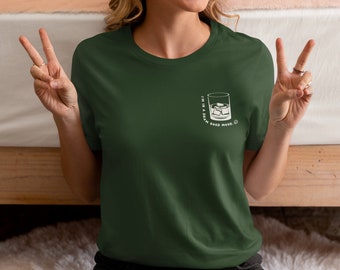 May include: A green t-shirt with a white graphic of a glass of ice with the text "I'm in a damn good mood."