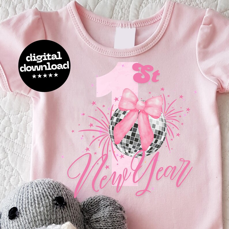 May include: Pink baby bodysuit with a New Year's theme. The design includes a pink number 1, a disco ball with a pink bow, and the words "New Year" in cursive. The text "digital download" is in a black circle.