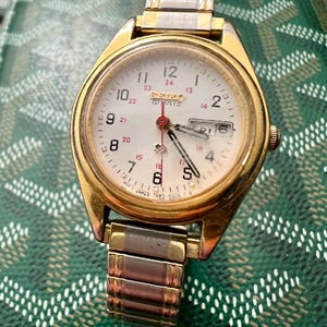 〇Nc左1045 昭和レトロ SEIKO QUARTZ DM303E オレンジ 〇Nc左1045 昭和レトロ SEIKO QUARTZ DM303E オレンジ