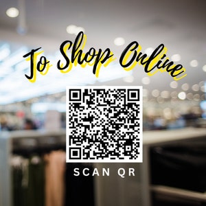 May include: A black and white QR code with the text "To Shop Online" in yellow and black lettering above it and the text "SCAN QR" below it. The background is a blurred image of a store interior.