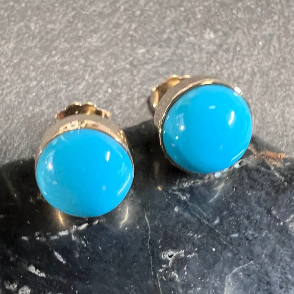 Round 6mm and 8mm robins egg blue Sleeping Beauty turquoise stud earrings set in 14k yellow gold  with pushback closure.